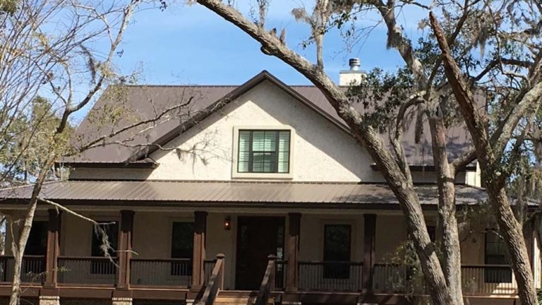 Metal roof installation on a St. Simons Georgia barrier island home built for high hurricane exposure and coastal wind.