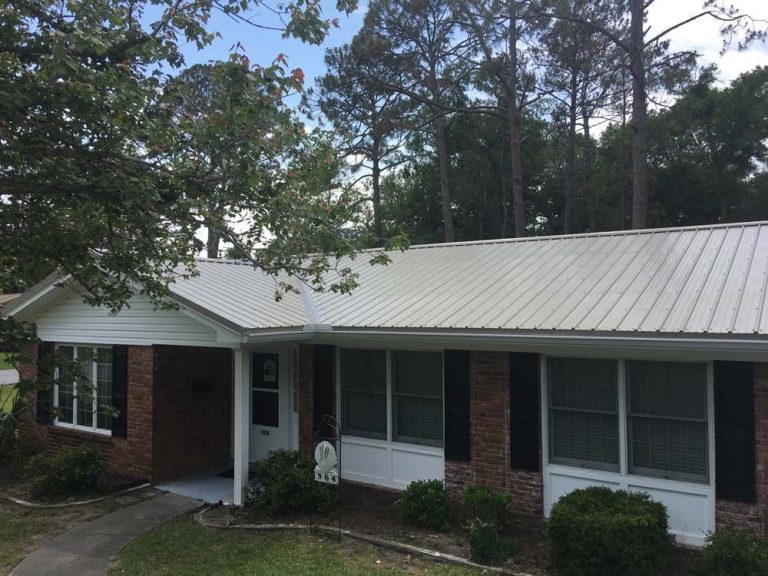 Metal roofing installation on an Evans County Georgia home during a hot summer afternoon.