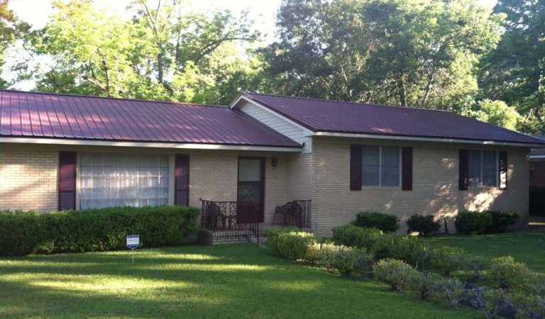 Close-up of Galvalume steel ridge cap installation by Eicher's Pro Vinyl crew in Waycross