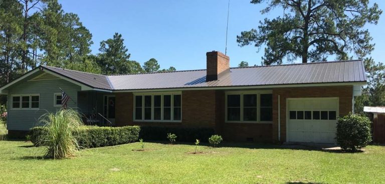 Metal roofing panels installed on a Coffee County Douglas Georgia home during heavy rain season.