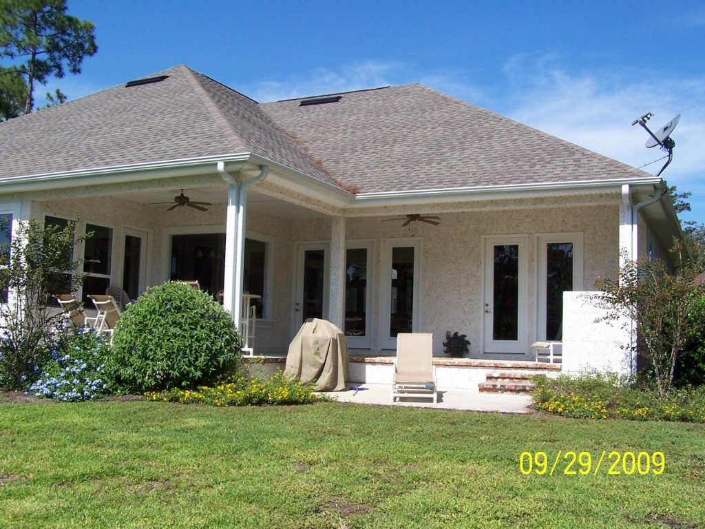 Custom seamless gutter installation protecting fascia and foundation on an Appling County Georgia home.