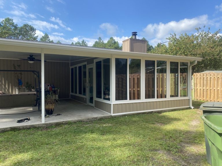 Steel carport protecting vehicles from Effingham County rain and storm debris near Savannah.