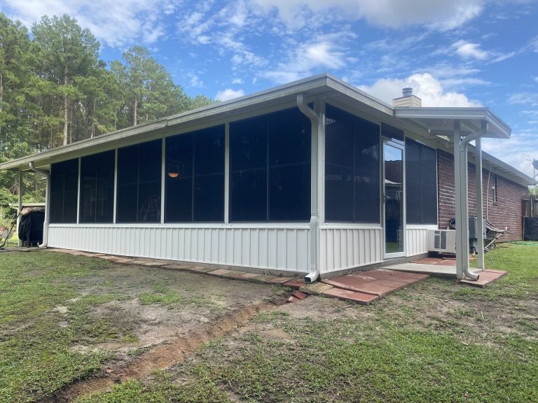 Custom vinyl glazed track panels installed on a Liberty County Georgia porch.
