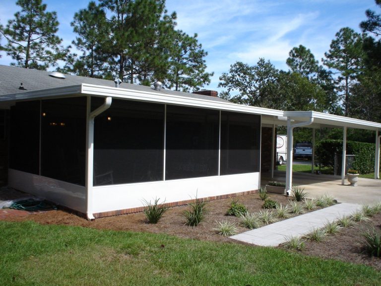 Steel carport protecting vehicles from Midway Georgia summer heat and rain