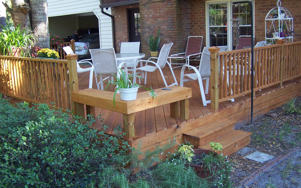 Pressure-treated wood deck installed on an Appling County Georgia home with mature pine canopy.