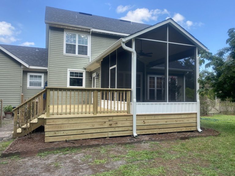 Custom wood porch with decorative columns and railings built in Camden County, Georgia.